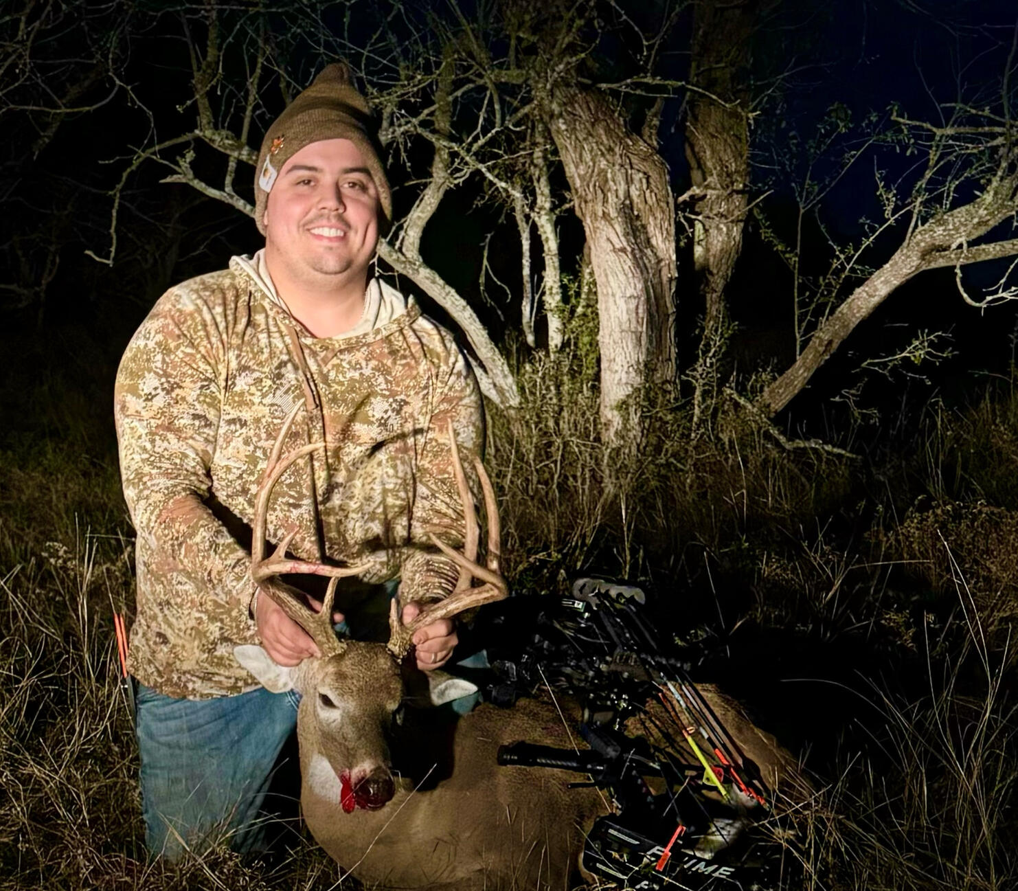 Beginner Success: STX Starter Setup in Action; A South Texas bowhunter smiles with a whitetail buck harvested using a starter bow setup from STX Archery.